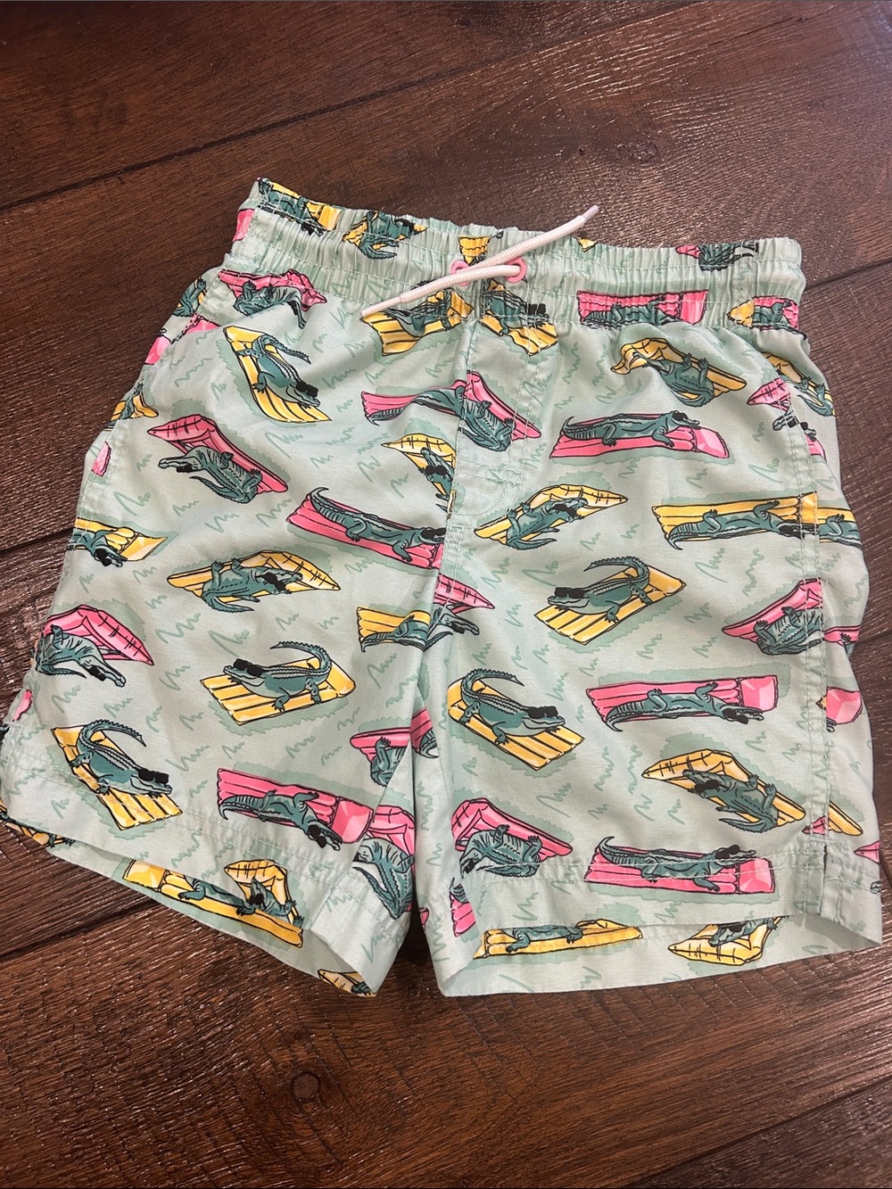 Old Navy Mint Green Swim Trunks with Surfboard Print